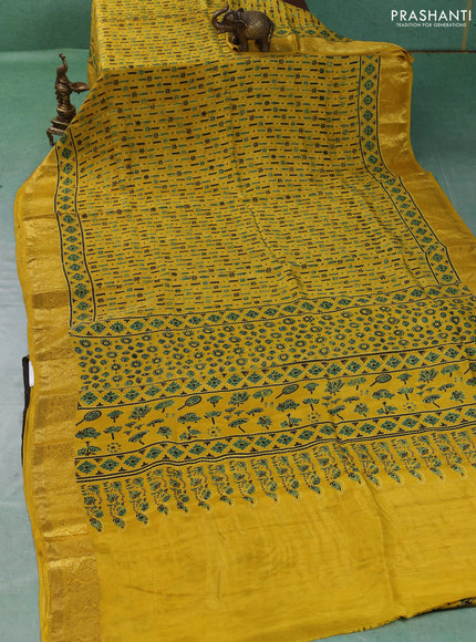 Dola silk saree yellow with allover ajrakh prints and zari woven border