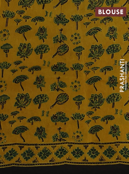 Dola silk saree yellow with allover ajrakh prints and zari woven border