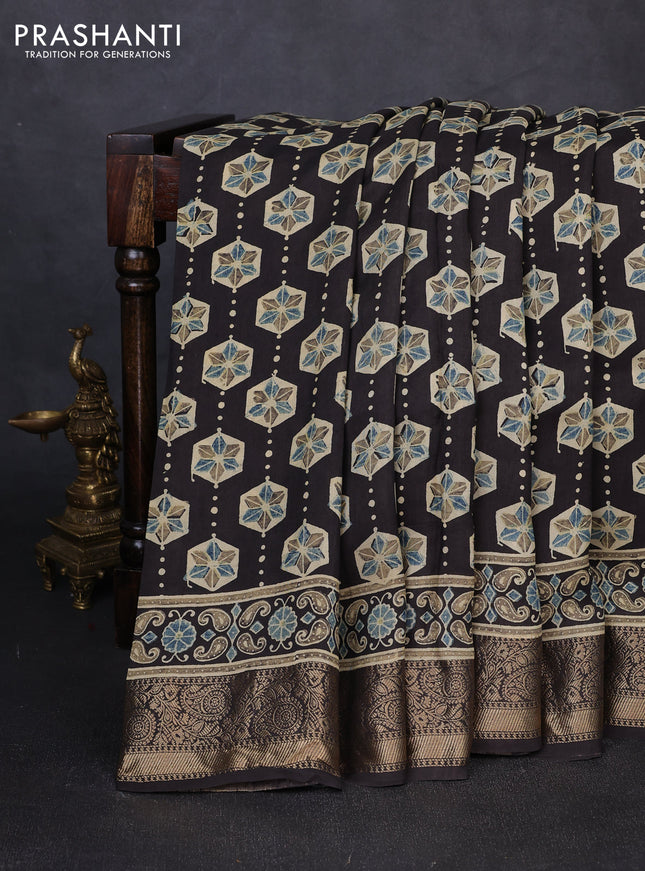 Dola silk saree black with allover ajrakh butta prints and zari woven border