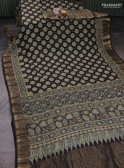 Dola silk saree black with allover ajrakh butta prints and zari woven border
