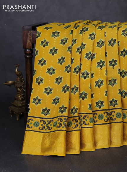 Dola silk saree yellow with allover ajrakh butta prints and zari woven border