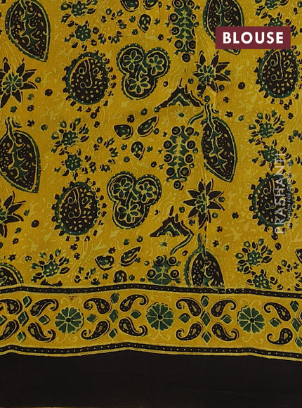 Dola silk saree yellow with allover ajrakh butta prints and zari woven border