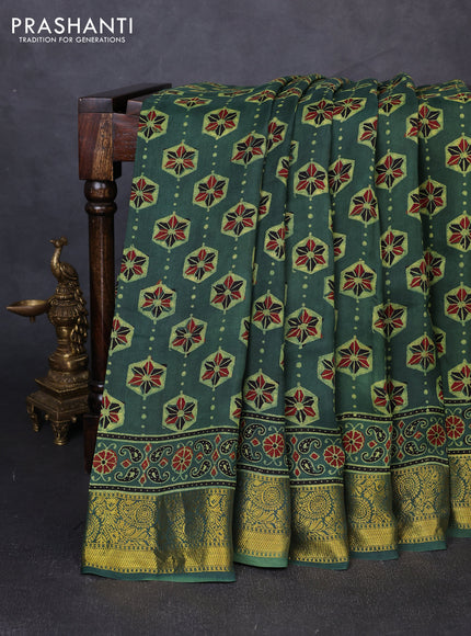Dola silk saree green shade with allover ajrakh butta prints and zari woven border