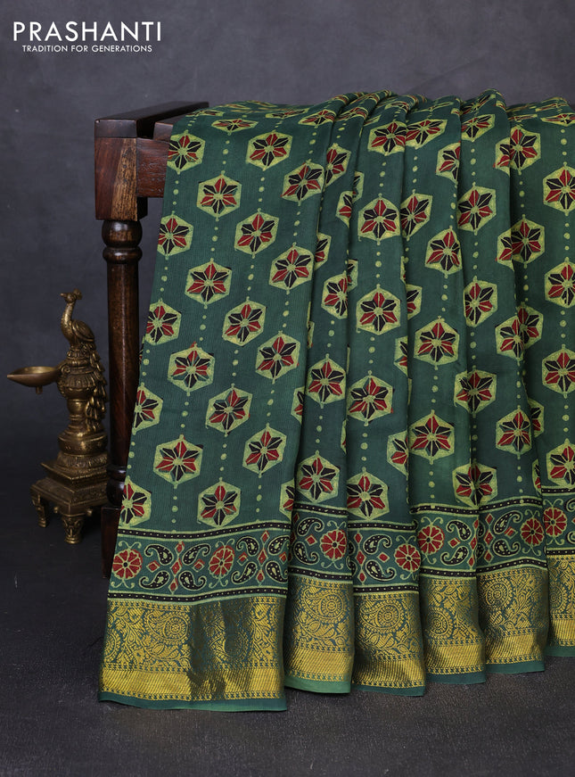 Dola silk saree green shade with allover ajrakh butta prints and zari woven border