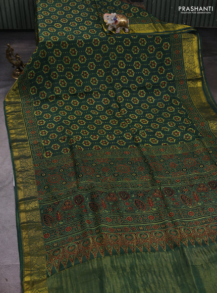 Dola silk saree green shade with allover ajrakh butta prints and zari woven border