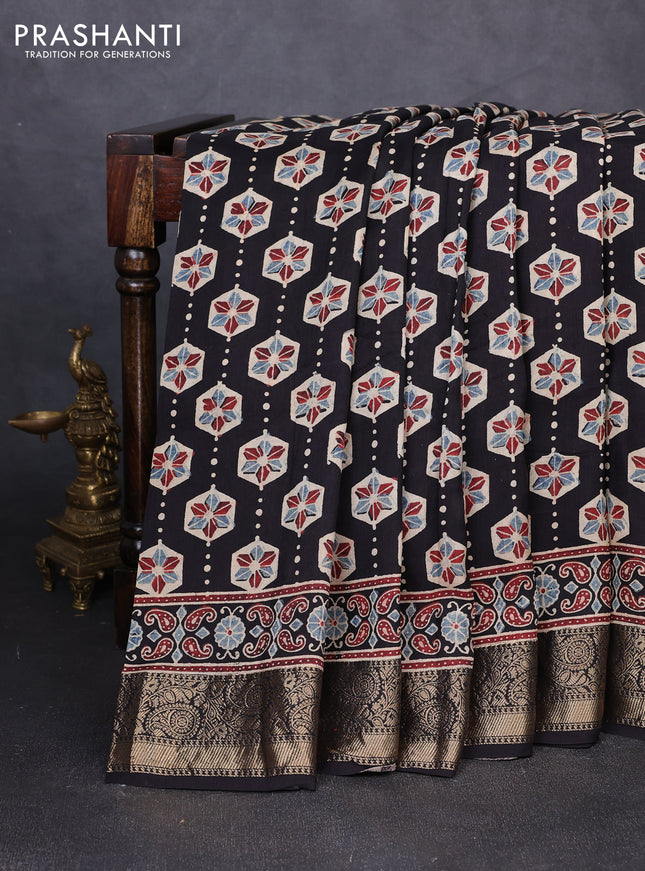 Dola silk saree black and blue shade with allover ajrakh butta prints and zari woven border