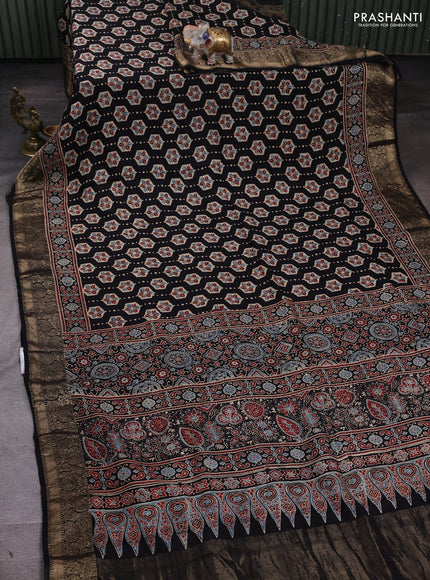 Dola silk saree black and blue shade with allover ajrakh butta prints and zari woven border