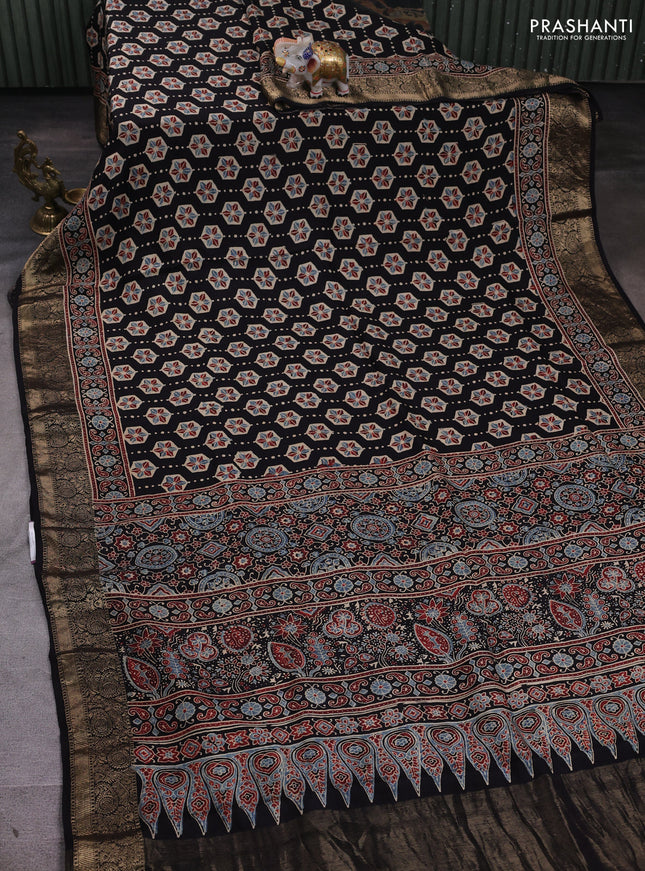 Dola silk saree black and blue shade with allover ajrakh butta prints and zari woven border