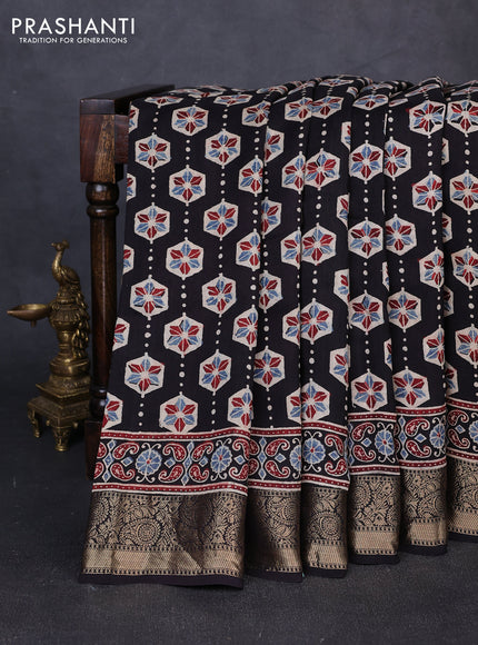 Dola silk saree black and maroon with allover ajrakh butta prints and zari woven border