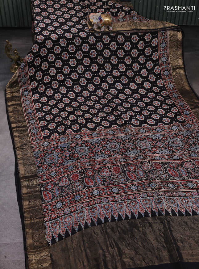 Dola silk saree black and maroon with allover ajrakh butta prints and zari woven border