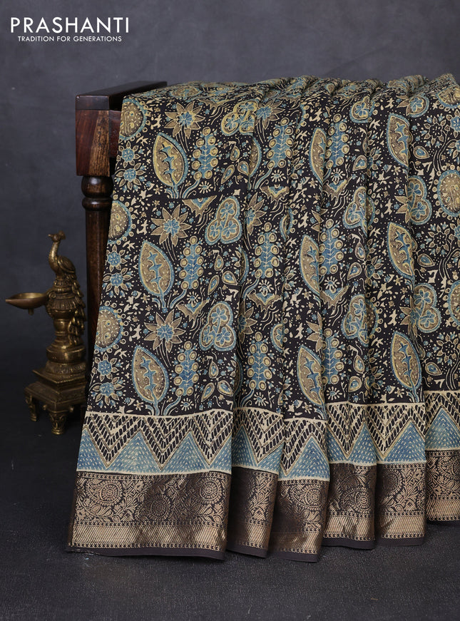 Dola silk saree black with allover ajrakh prints and zari woven border