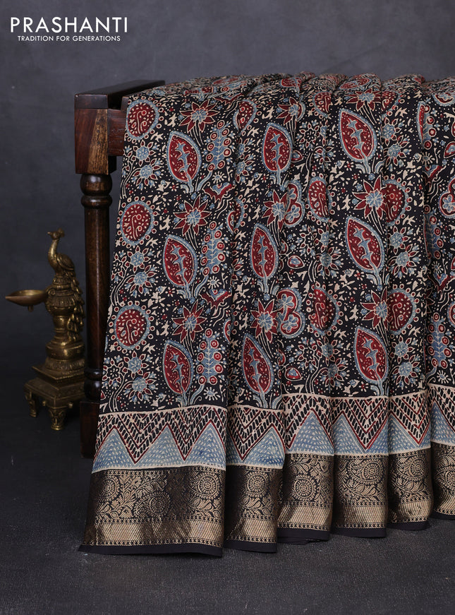 Dola silk saree black with allover ajrakh prints and zari woven border