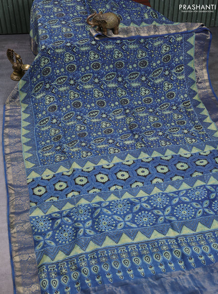 Dola silk saree indigo blue with allover ajrakh prints and zari woven border
