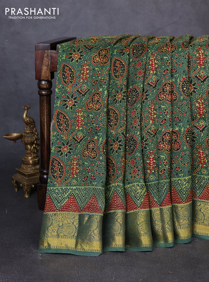 Dola silk saree green with allover ajrakh prints and zari woven border