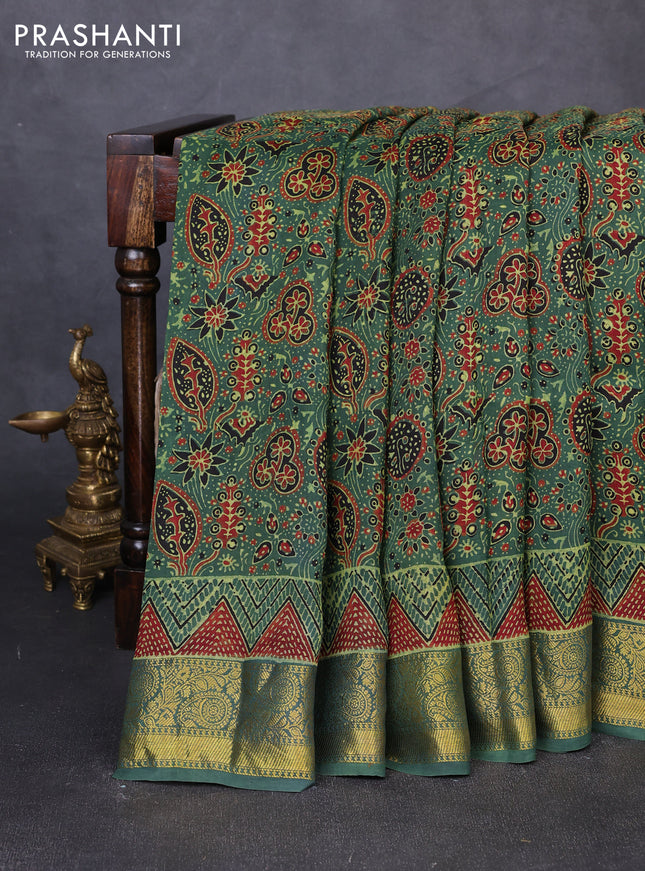 Dola silk saree green with allover ajrakh prints and zari woven border