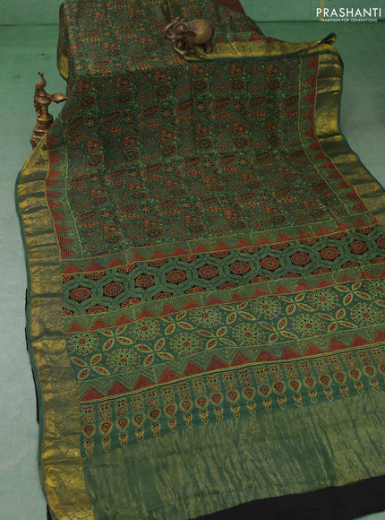 Dola silk saree green with allover ajrakh prints and zari woven border