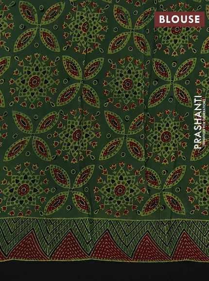 Dola silk saree green with allover ajrakh prints and zari woven border