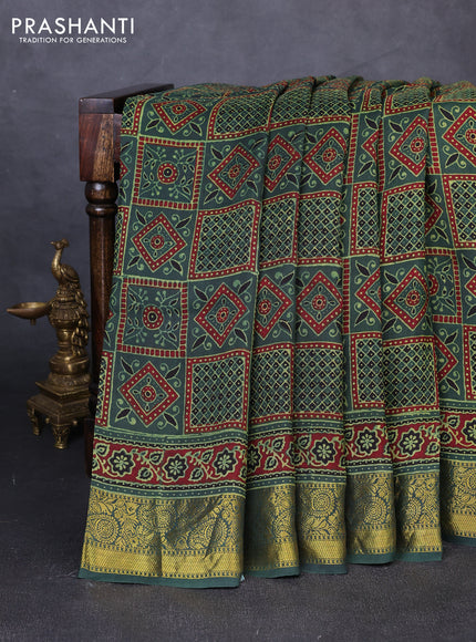 Dola silk saree green shade and maroon with allover ajrakh prints and zari woven border