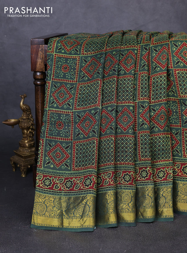 Dola silk saree green shade and maroon with allover ajrakh prints and zari woven border