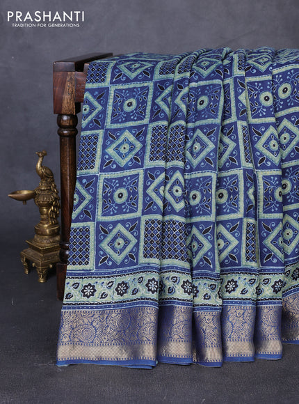 Dola silk saree indigo blue with allover ajrakh prints and zari woven border