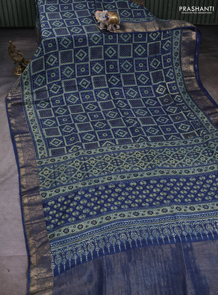 Dola silk saree indigo blue with allover ajrakh prints and zari woven border