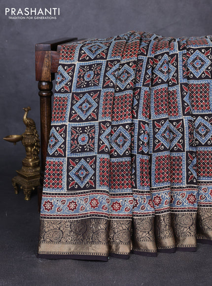 Dola silk saree indigo blue and maroon with allover ajrakh prints and zari woven border