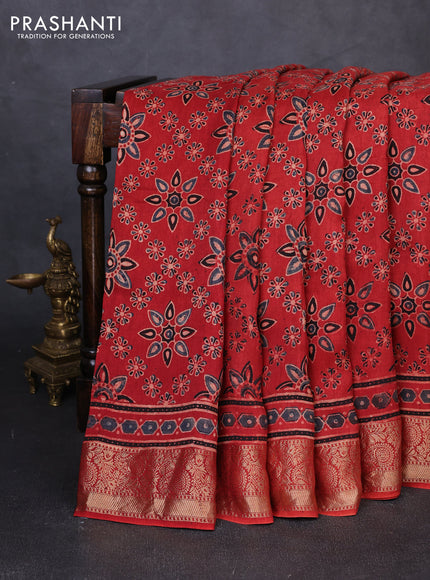 Dola silk saree maroon with allover butta prints and zari woven border