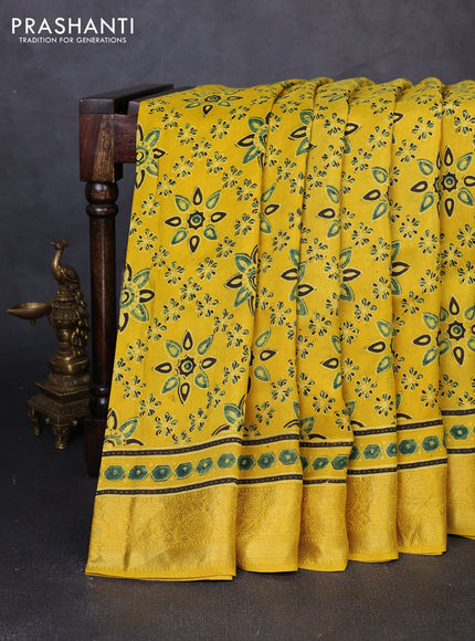 Dola silk saree yellow with allover butta prints and zari woven border