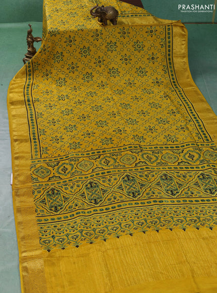 Dola silk saree yellow with allover butta prints and zari woven border