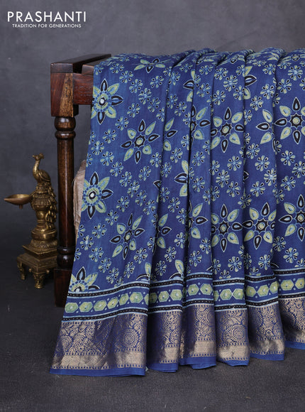 Dola silk saree blue with allover butta prints and zari woven border