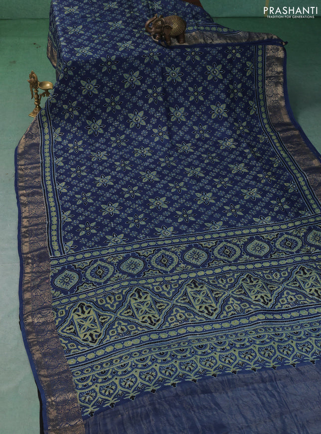 Dola silk saree blue with allover butta prints and zari woven border