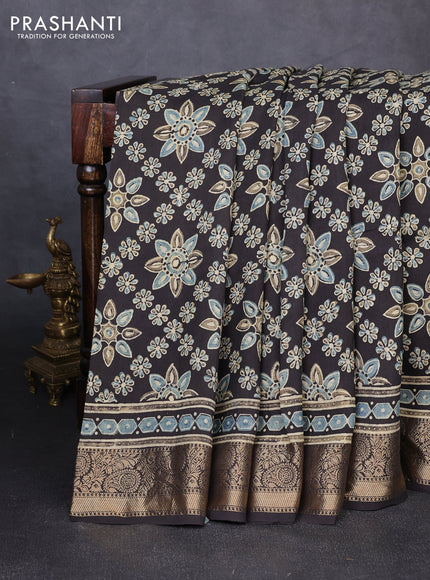 Dola silk saree black with allover butta prints and zari woven border
