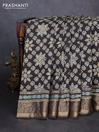 Dola silk saree black with allover butta prints and zari woven border