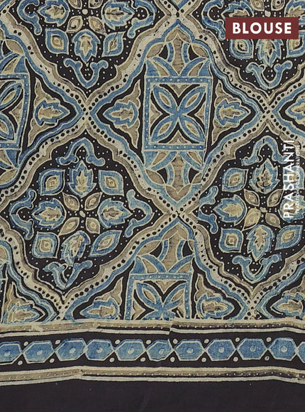 Dola silk saree black with allover butta prints and zari woven border