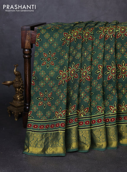 Dola silk saree green with allover butta prints and zari woven border