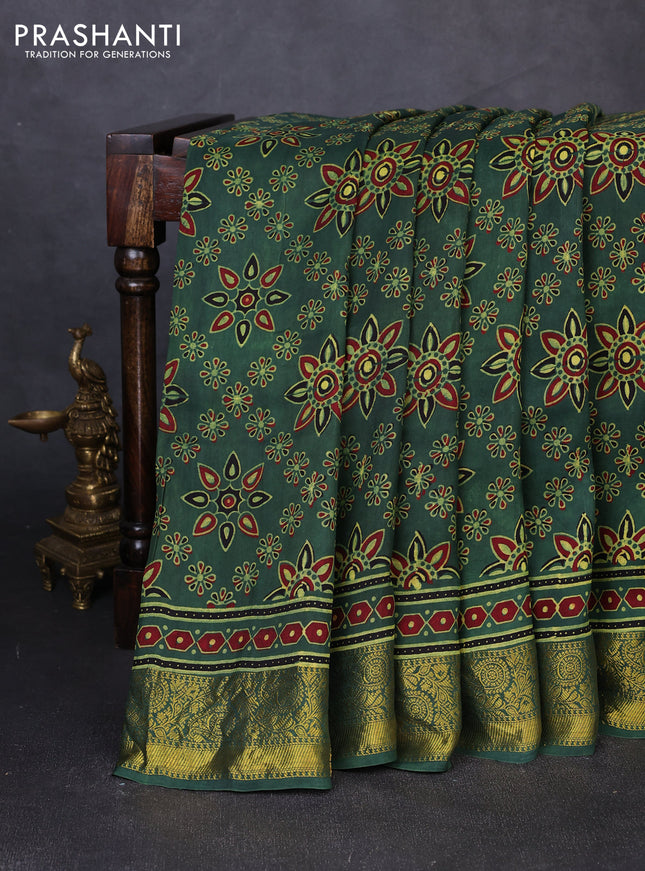 Dola silk saree green with allover butta prints and zari woven border