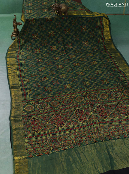 Dola silk saree green with allover butta prints and zari woven border