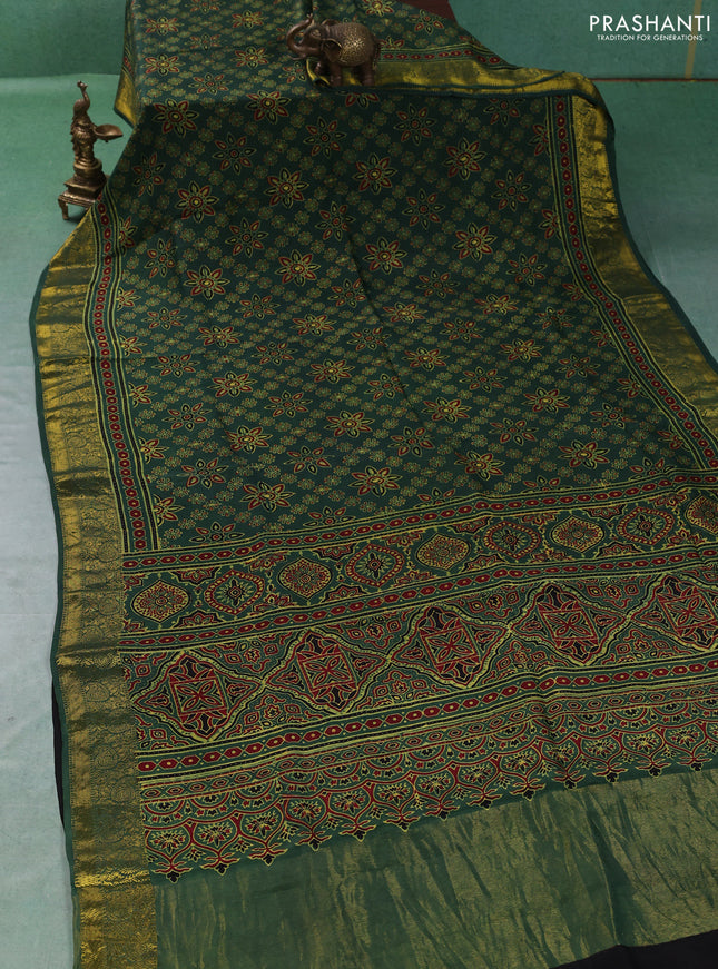 Dola silk saree green with allover butta prints and zari woven border