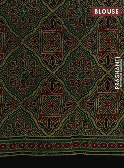 Dola silk saree green with allover butta prints and zari woven border