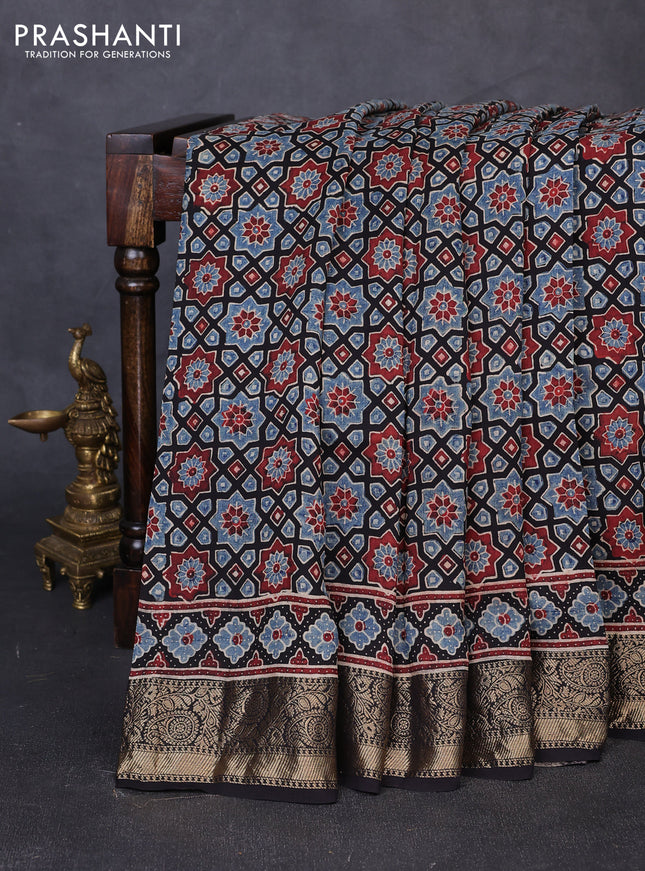 Dola silk saree black and maroon with allover ajrakh prints and zari woven border