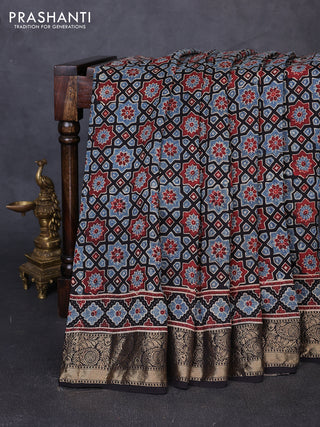Dola silk saree black and maroon with allover ajrakh prints and zari woven border
