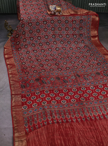 Dola silk saree maroon with allover ajrakh prints and zari woven border