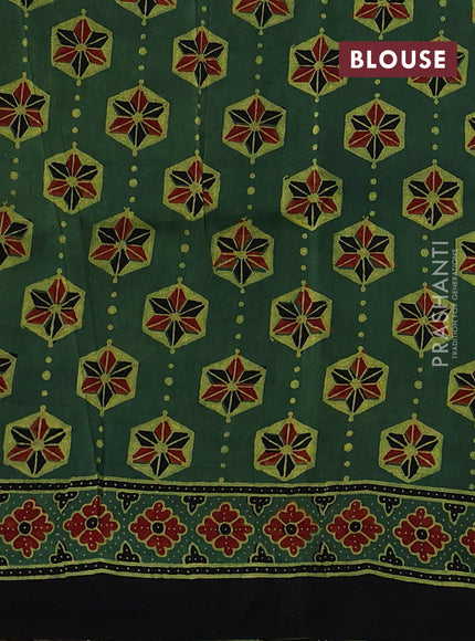 Dola silk saree green shade with allover ajrakh prints and zari woven border