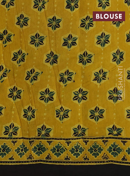 Dola silk saree yellow with allover ajrakh prints and zari woven border