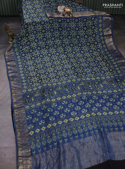 Dola silk saree blue shade with allover ajrakh prints and zari woven border