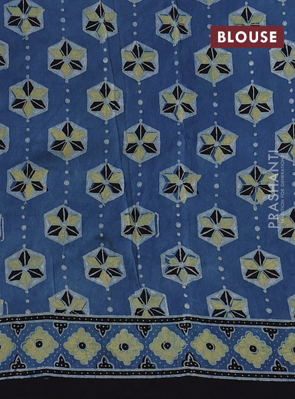 Dola silk saree blue shade with allover ajrakh prints and zari woven border