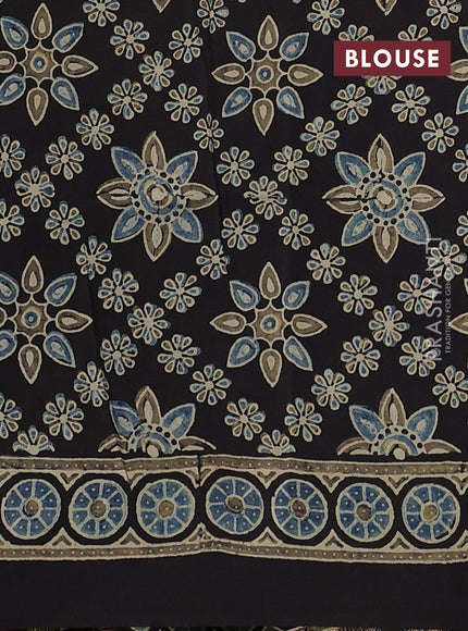 Dola silk saree blue shade with allover ajrakh prints and zari woven border