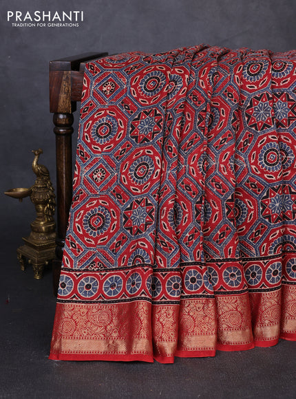 Dola silk saree maroon with allover ajrakh prints and zari woven border