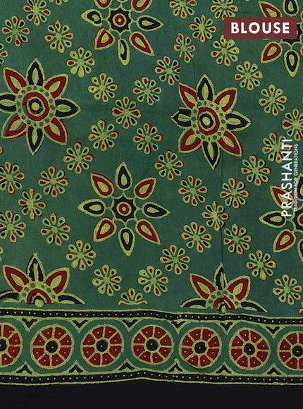 Dola silk saree green shade with allover ajrakh prints and zari woven border