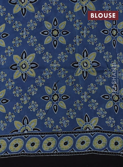 Dola silk saree blue shade with allover ajrakh prints and zari woven border